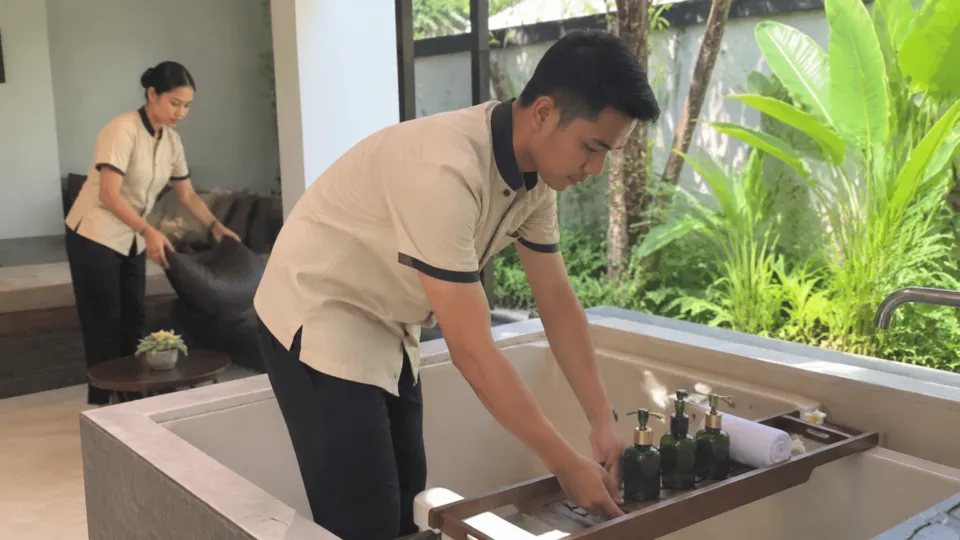 Hospitality staff preparing a welcoming guest area